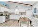 Well-lit kitchen with white cabinets, stainless steel appliances, and tile backsplash at 10024 Tealridge Ln, Charlotte, NC 28277