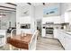 Bright kitchen featuring white cabinets, stainless steel appliances, and a breakfast nook at 10024 Tealridge Ln, Charlotte, NC 28277