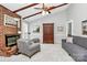 Bright living room with a fireplace, ceiling fan and wood beam ceiling at 10024 Tealridge Ln, Charlotte, NC 28277