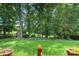Secluded backyard with mature trees creating a peaceful retreat at 1012 Lightwood Dr, Matthews, NC 28105