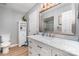 Clean bathroom featuring a large vanity, marble countertops, and a glass enclosed shower at 1012 Lightwood Dr, Matthews, NC 28105