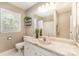 Bright bathroom features a shower/tub combo and marble-look vanity at 1012 Lightwood Dr, Matthews, NC 28105