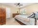 A cozy bedroom features a ceiling fan, window and neutral color palette at 1012 Lightwood Dr, Matthews, NC 28105