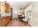 Inviting dining room featuring hardwood floors, natural light, and neutral wall paint at 1012 Lightwood Dr, Matthews, NC 28105