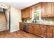 Well-lit kitchen featuring stainless steel appliances, tile backsplash, granite countertops, and hardwood floors at 1012 Lightwood Dr, Matthews, NC 28105