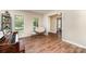 Cozy living room featuring hardwood floors, natural light, and comfortable seating at 1012 Lightwood Dr, Matthews, NC 28105
