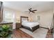 Comfortable main bedroom with a ceiling fan, neutral walls, and natural light at 1012 Lightwood Dr, Matthews, NC 28105