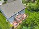 This aerial view shows the home with a large yard and a deck overlooking the beautiful landscaping at 1017 Quail Run Ct, Indian Land, SC 29707