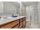 Bathroom featuring a double sink vanity, and a glass-enclosed shower at 1017 Quail Run Ct, Indian Land, SC 29707