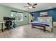 Bright bedroom with a ceiling fan, desk, and sunny windows at 1017 Quail Run Ct, Indian Land, SC 29707