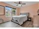 This stylish bedroom features a neutral color palette, large windows, and modern decor at 1017 Quail Run Ct, Indian Land, SC 29707