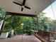 Relax on the covered patio, featuring a charming porch swing and soothing garden elements at 1017 Quail Run Ct, Indian Land, SC 29707