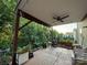 This covered patio offers an ideal outdoor retreat, complete with a ceiling fan and garden view at 1017 Quail Run Ct, Indian Land, SC 29707