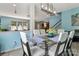 Open concept dining room with grey wood-look flooring, and view into the kitchen at 1017 Quail Run Ct, Indian Land, SC 29707