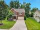 Charming two-story brick home with a well-manicured lawn and an inviting driveway at 1017 Quail Run Ct, Indian Land, SC 29707