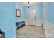 Bright foyer with blue walls, grey wood-look flooring, and a comfortable bench at 1017 Quail Run Ct, Indian Land, SC 29707