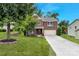 Charming two-story brick home featuring a well-manicured lawn and a two-car garage at 1017 Quail Run Ct, Indian Land, SC 29707