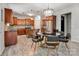 Well-lit kitchen with stainless appliances, and connecting dining area at 1017 Quail Run Ct, Indian Land, SC 29707