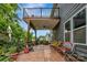 Charming home featuring a cozy back patio with a seating area, string lights, and a fountain at 1017 Quail Run Ct, Indian Land, SC 29707