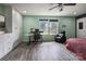Bedroom with modern white wardrobe, desk with monitors, and a comfortable chair and fan at 1017 Quail Run Ct, Indian Land, SC 29707