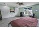 Spacious bedroom with white wardrobe, desk with monitors, a bed, and ample natural light from the window at 1017 Quail Run Ct, Indian Land, SC 29707