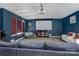 Living room showcasing projector screen, comfortable seating, and stylish decor at 1017 Quail Run Ct, Indian Land, SC 29707