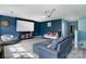 Bright living room featuring projector screen, comfortable seating, and stylish decor elements at 1017 Quail Run Ct, Indian Land, SC 29707