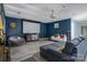 Living room features a projector screen, comfortable seating, and stylish decor at 1017 Quail Run Ct, Indian Land, SC 29707