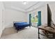 Bright bedroom with tray ceilings, blue curtains, and a large window overlooking the yard at 104 E Louisiana Ave, Bessemer City, NC 28016