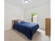 Bright bedroom with a large window that provides natural light and a view of the outdoors at 104 E Louisiana Ave, Bessemer City, NC 28016