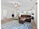 Inviting open concept with hardwood floors, view to kitchen, bath, and bedroom, comfortable leather seating, and natural light at 104 E Louisiana Ave, Bessemer City, NC 28016