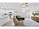 Bright open concept with kitchen view, hardwood floors, TV, ceiling fan and plenty of natural light at 104 E Louisiana Ave, Bessemer City, NC 28016
