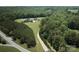 Aerial view of an estate featuring lush green forest and a long driveway at 109 Oak Forest Dr, Kings Mountain, NC 28086