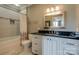 Bright bathroom with granite countertop, white cabinets, and shower with white tile at 109 Oak Forest Dr, Kings Mountain, NC 28086