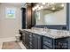 Elegant bathroom with dual vanities, granite countertops, and a large mirror at 109 Oak Forest Dr, Kings Mountain, NC 28086