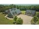 Exterior shot of a home with a two-car garage and a well manicured lawn at 109 Oak Forest Dr, Kings Mountain, NC 28086
