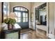 Inviting foyer with hardwood floors, decorative table and front door with sidelights at 109 Oak Forest Dr, Kings Mountain, NC 28086