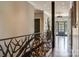 Inviting hallway with hardwood floors, custom railing, and natural light at 109 Oak Forest Dr, Kings Mountain, NC 28086
