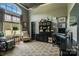 Comfortable home office with a large window, sitting area and built-in cabinets at 109 Oak Forest Dr, Kings Mountain, NC 28086
