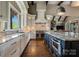 Well-appointed kitchen boasts granite countertops, stainless steel appliances, and an island with seating at 109 Oak Forest Dr, Kings Mountain, NC 28086