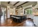 Elegant kitchen boasts an oversized island, custom cabinets, and pendant lighting fixtures at 109 Oak Forest Dr, Kings Mountain, NC 28086
