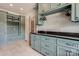 Well-organized laundry room with built-in cabinets, granite countertops and ample storage at 109 Oak Forest Dr, Kings Mountain, NC 28086
