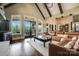 Bright living room featuring hardwood floors, vaulted ceilings, and access to an outdoor balcony at 109 Oak Forest Dr, Kings Mountain, NC 28086