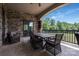 Cozy outdoor seating area with stone columns, and a table for comfortable outdoor dining at 109 Oak Forest Dr, Kings Mountain, NC 28086