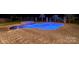 Beautiful in-ground pool with stone-trimmed hot tub and water features at 109 Oak Forest Dr, Kings Mountain, NC 28086
