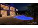 Private backyard oasis featuring a stunning in-ground pool, spa, and stone patio at 109 Oak Forest Dr, Kings Mountain, NC 28086