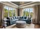 Comfortable sitting area with large windows, plush seating, and elegant decor at 109 Oak Forest Dr, Kings Mountain, NC 28086