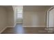 Bedroom featuring wood-look flooring, neutral walls, window and white trim at 112 Hampton St, Chester, SC 29706