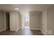 Bedroom with dark laminate flooring, neutral paint, and closet storage at 112 Hampton St, Chester, SC 29706