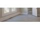 Bedroom with grey laminate flooring, white trim, large windows and neutral paint at 112 Hampton St, Chester, SC 29706